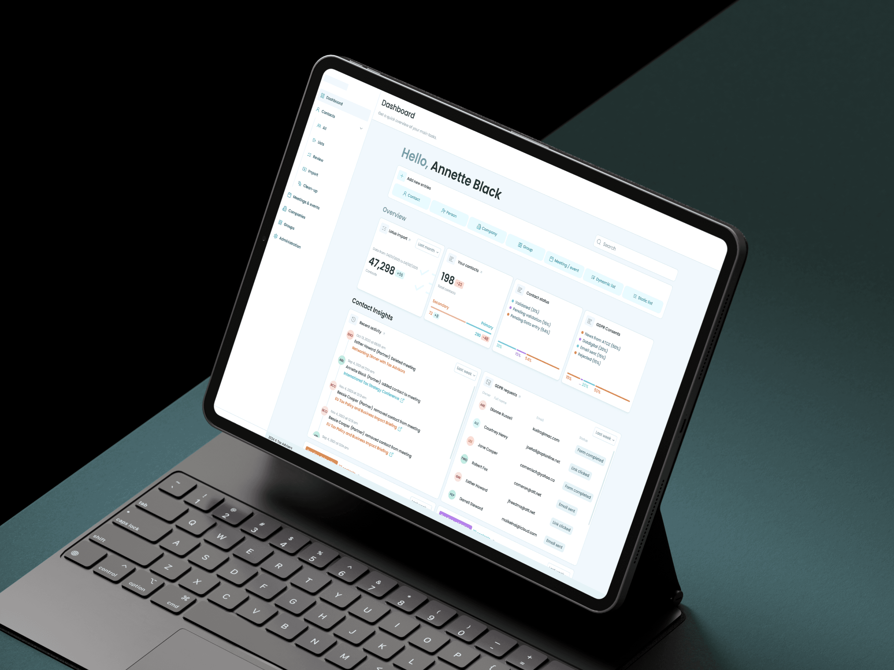 CRM dashboard with contact insights, shown on a tablet with a keyboard